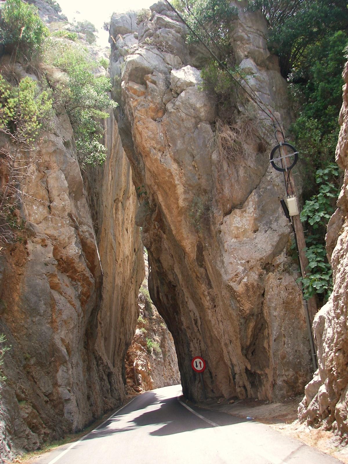 The Sa Calobra road passing through a narrow gap between tall rock faces