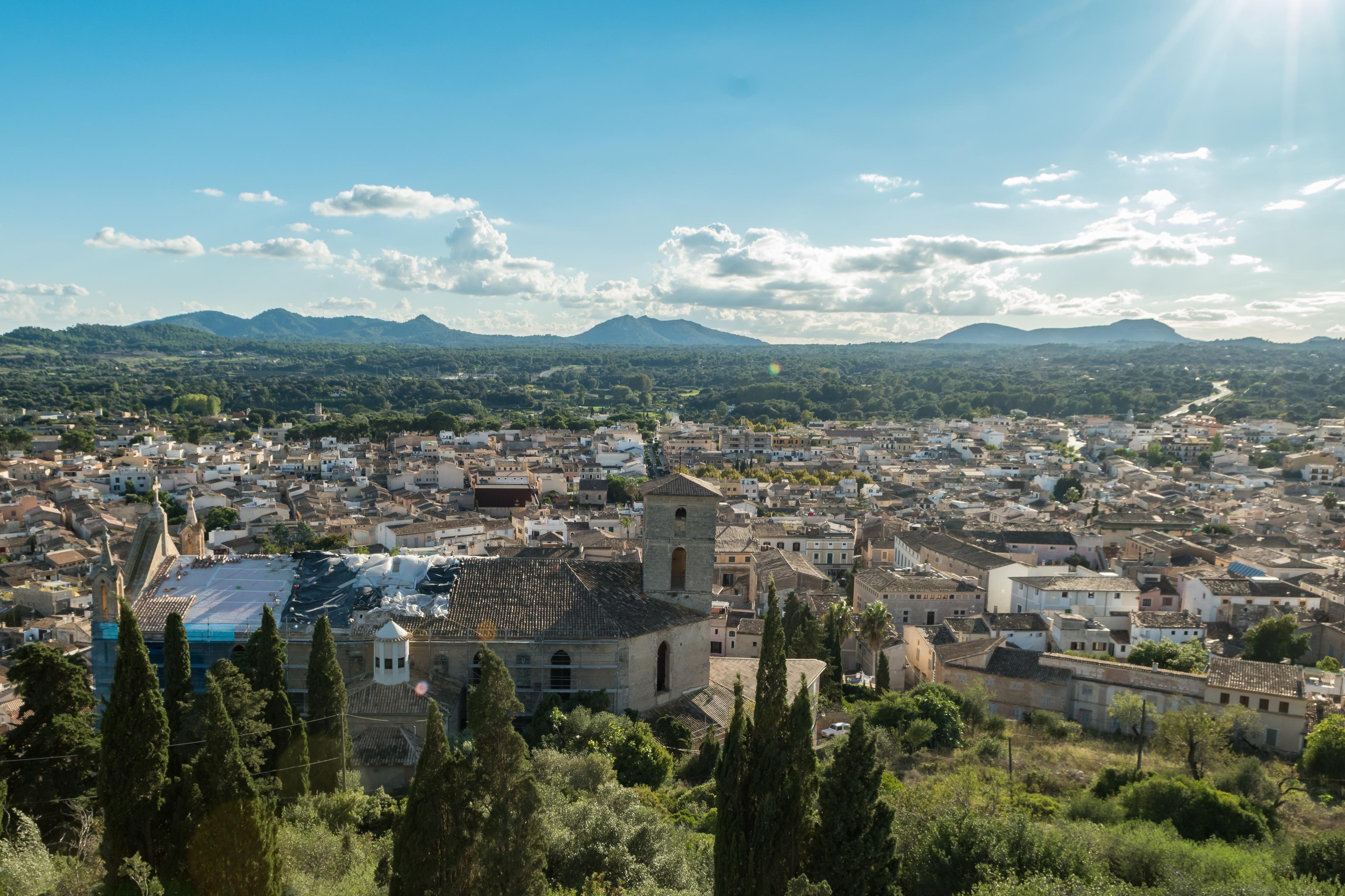 A view over Artà’s tiled rooftops and church towards the surrounding countryside