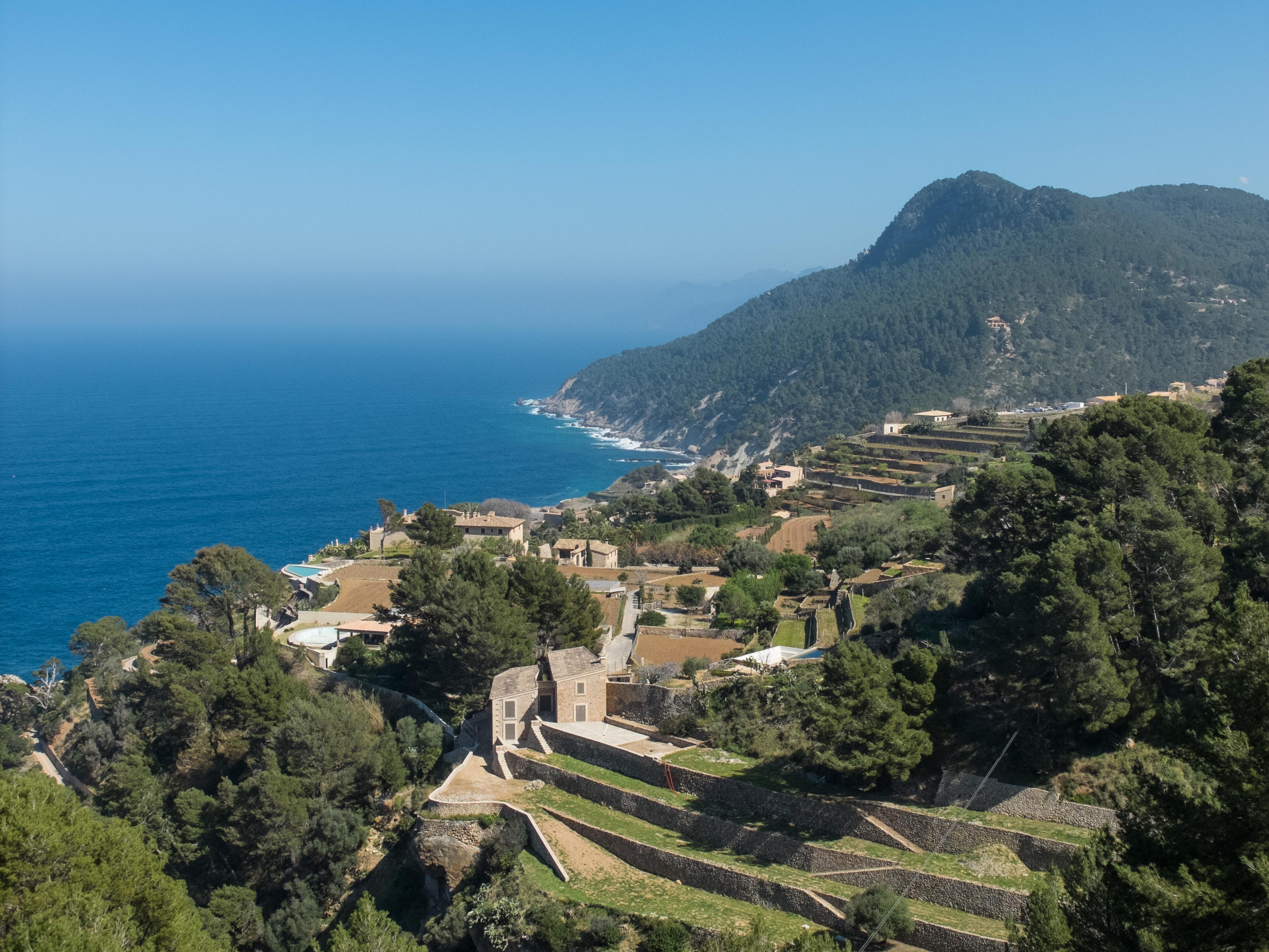 Stone agricultural terraces stepping down towards the Mediterranean at Banyalbufar